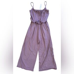 Lavendar spaghetti strap jumpsuit with a scoop neckline. Size small